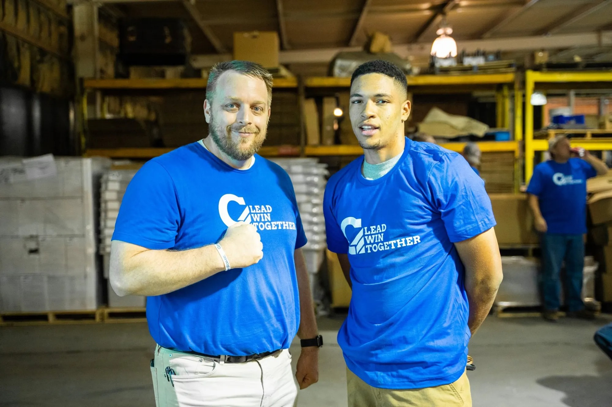 two men pose for photo